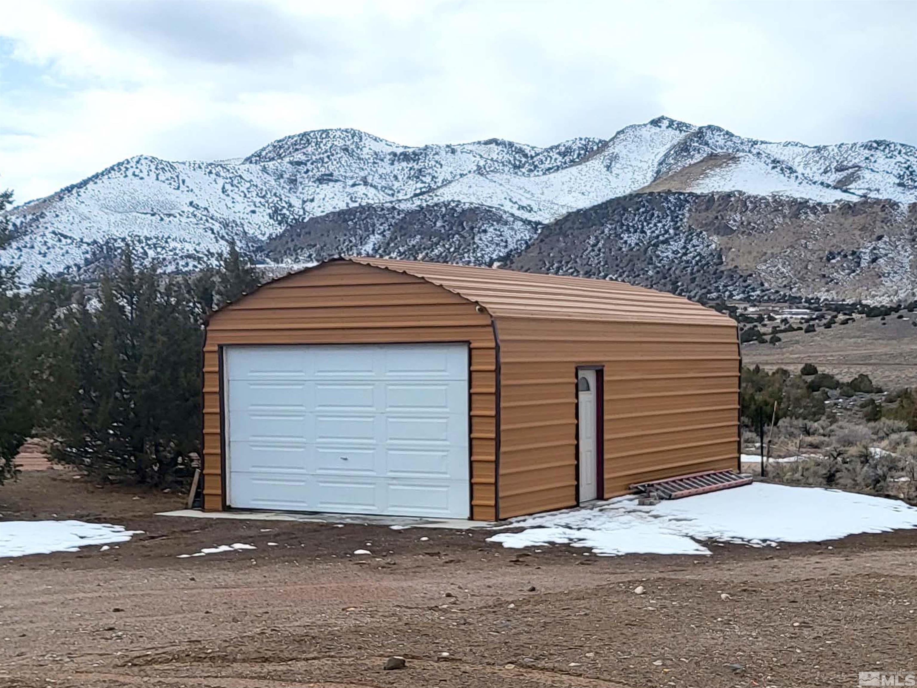 2700 Wilcox Ranch Road Reno, NV 89510 - Photo 3 of 33 a front view of a house with mountain view