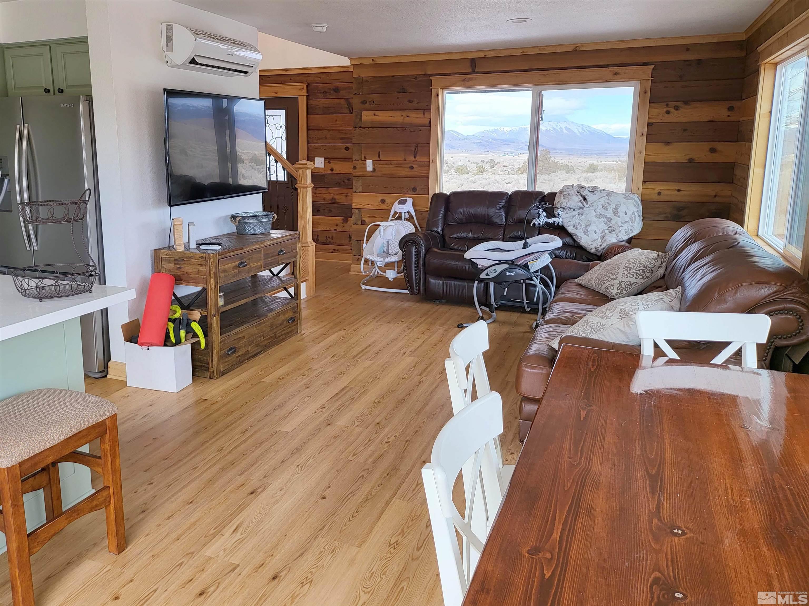 2700 Wilcox Ranch Road Reno, NV 89510 - Photo 4 of 33 a living room with furniture and a flat screen tv