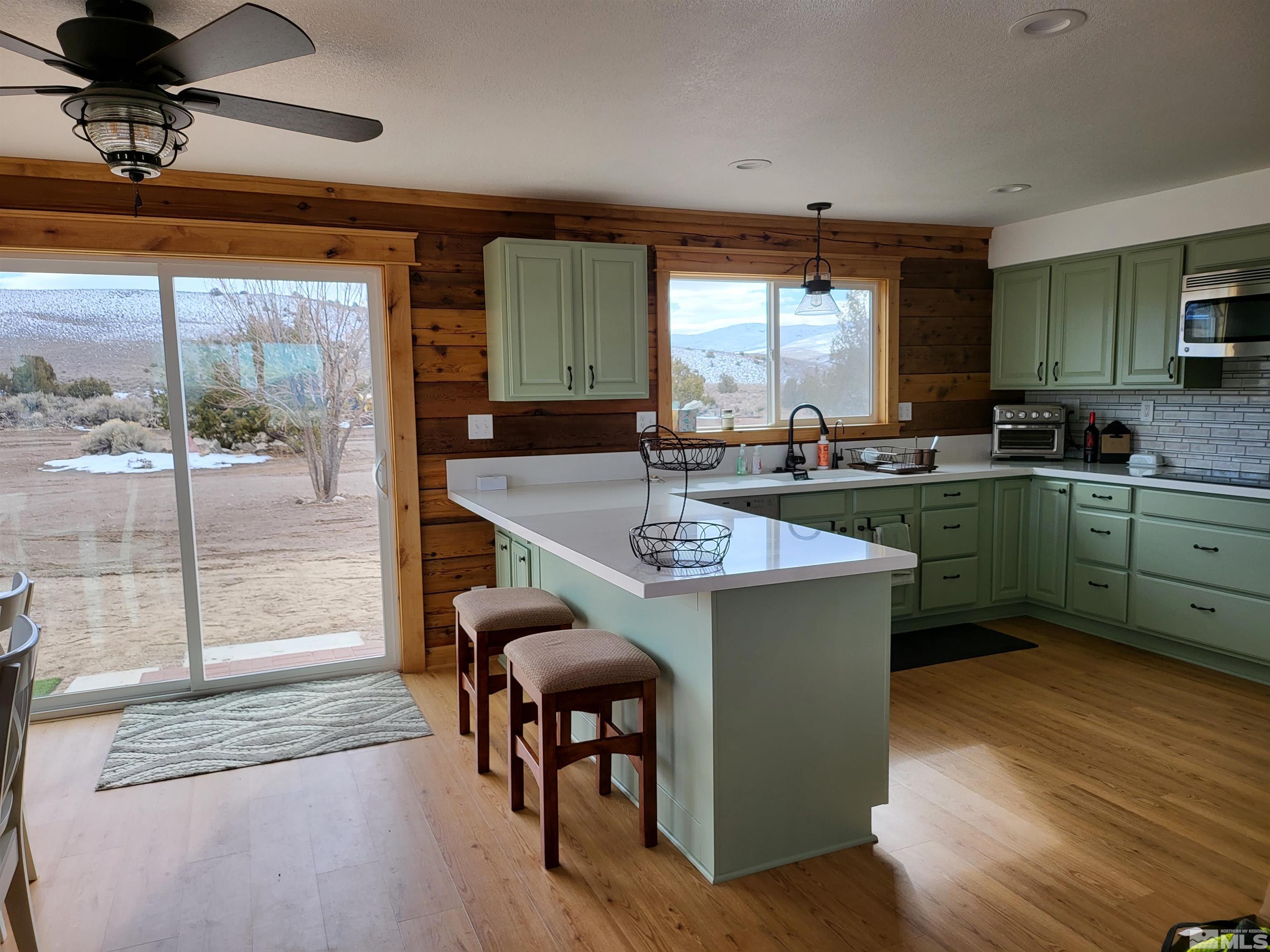 2700 Wilcox Ranch Road Reno, NV 89510 - Photo 7 of 33 a kitchen with a sink cabinets and dining table