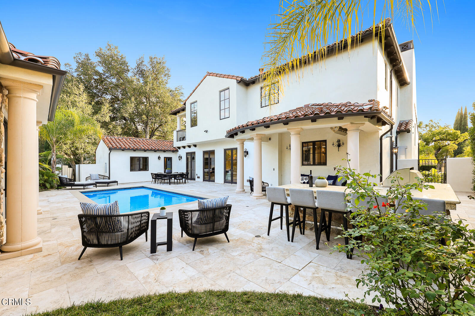 675 Elliott Drive Pasadena, CA 91106 - Photo 33 of 39 a view of a patio with table and chairs potted plants and a large tree