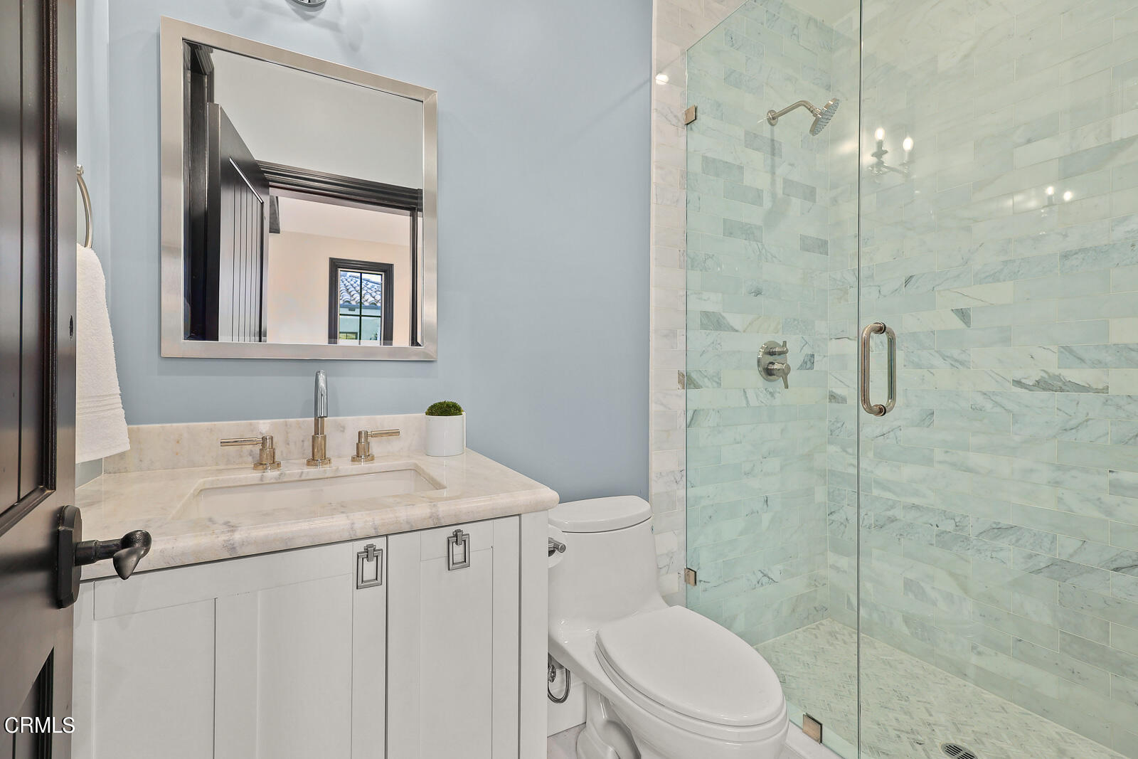 675 Elliott Drive Pasadena, CA 91106 - Photo 38 of 39 a bathroom with a granite countertop sink toilet a mirror a shower and vanity