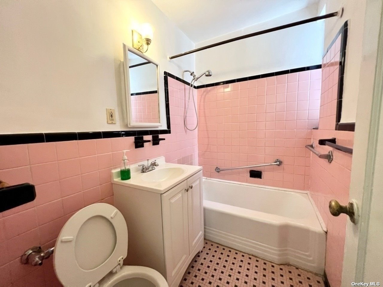 112-24 Northern Boulevard, Unit 4B Queens, NY 11368 - Photo 9 of 9 a bathroom with a sink a toilet and shower
