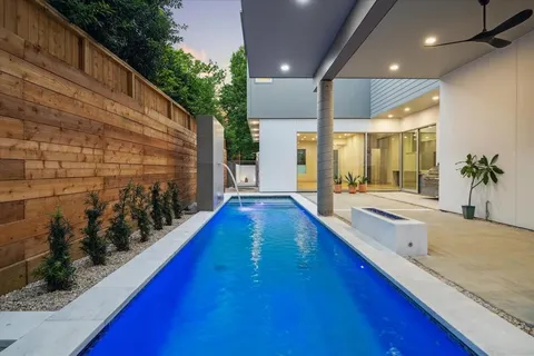 a view of swimming pool with outdoor seating