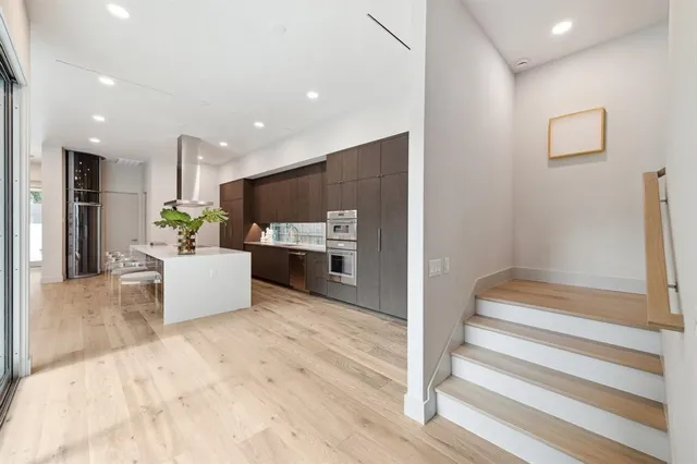 a view of kitchen with furniture and refrigerator