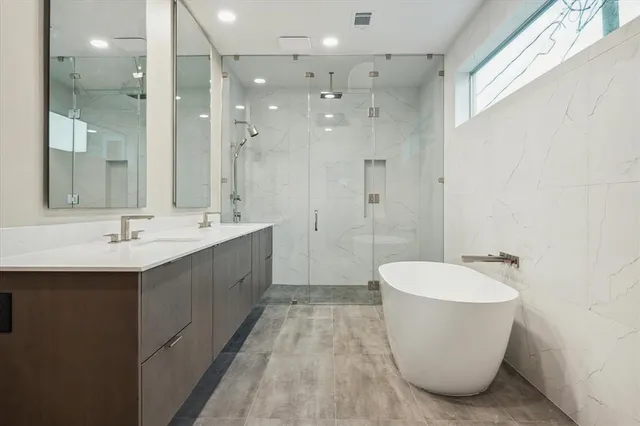 a bathroom with a double vanity sink mirror and double