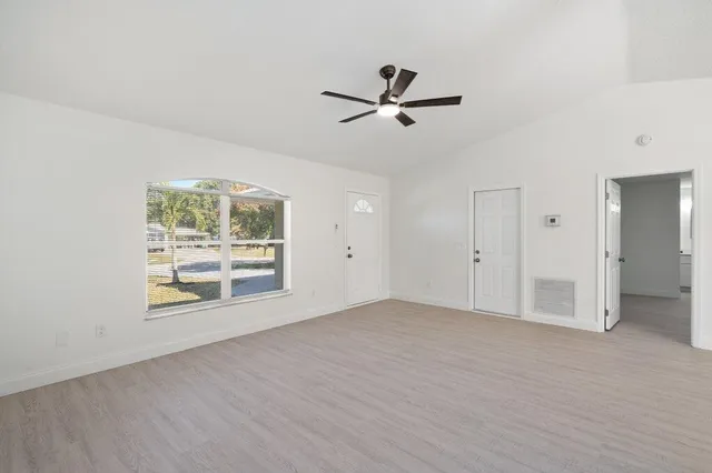 a view of an empty room with a window