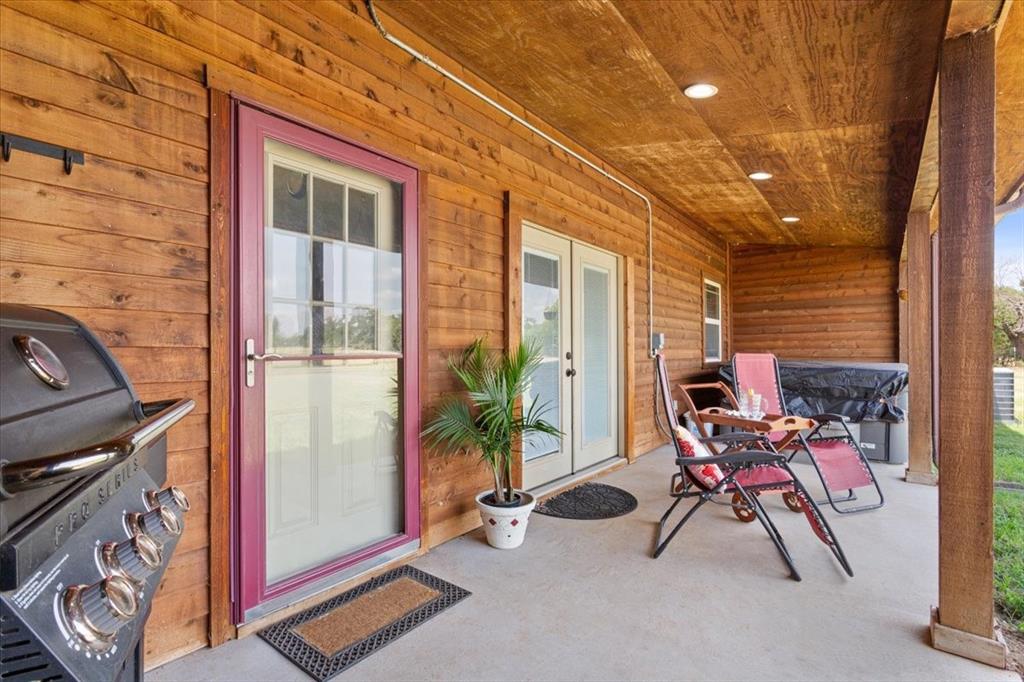 174 Ross Rd Spur Waco, TX 76705 - Photo 28 of 40 Back Patio with land and pool views. Spa will convey!