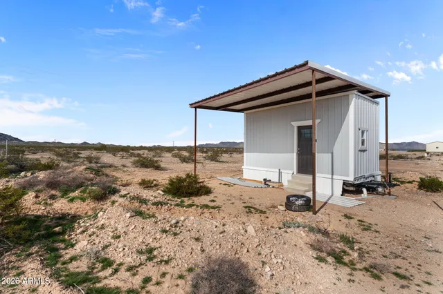 a kitchen with a sink cabinets and window