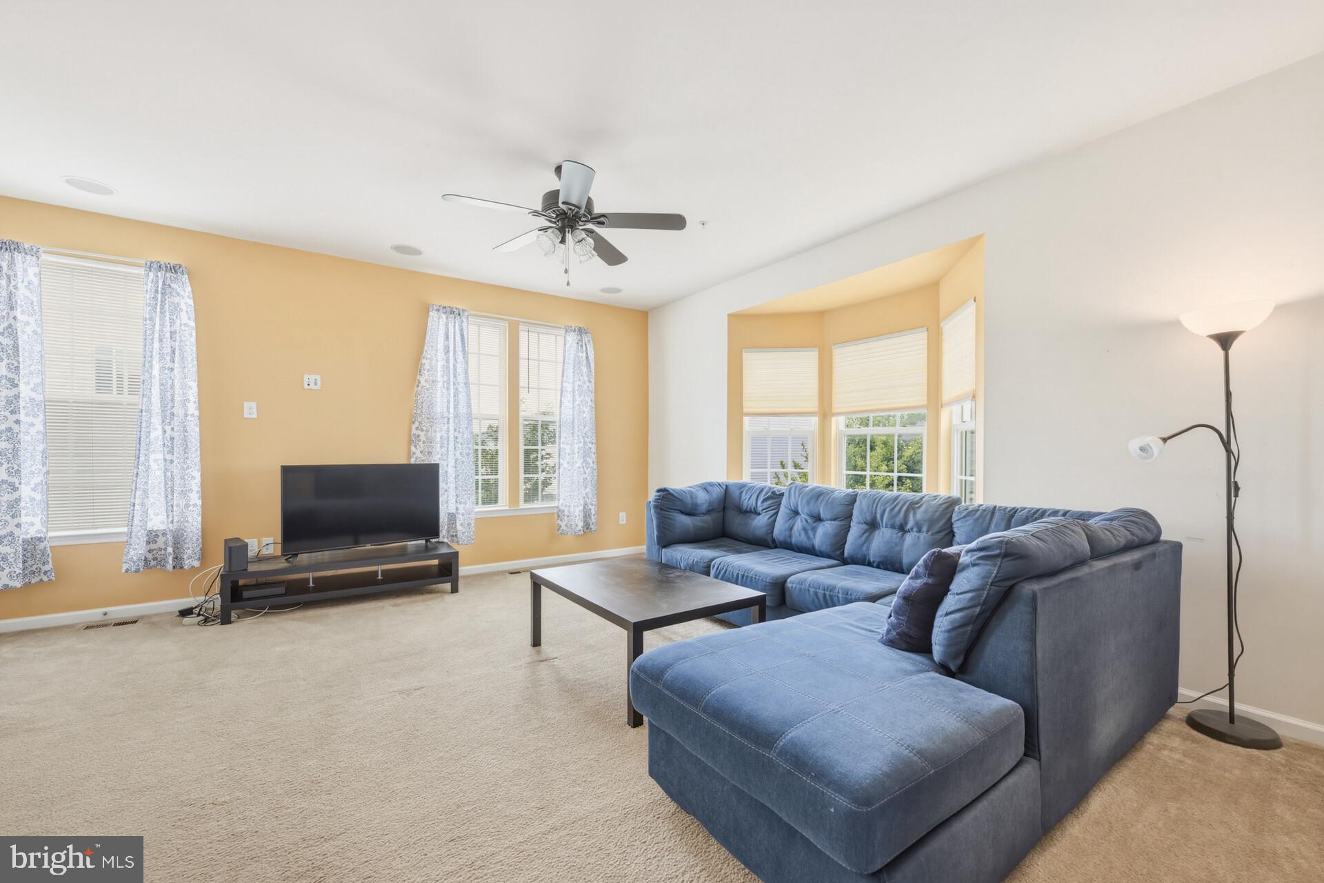 325 Schmidt Road Phoenixville, PA 19460 - Photo 13 of 27 a living room with furniture and a flat screen tv