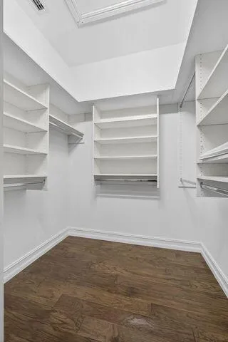 a view of an empty walk in closet