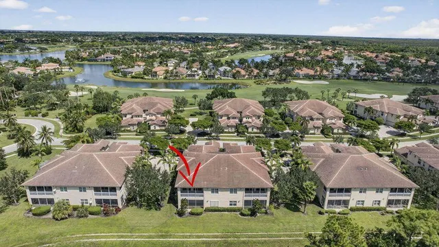 an aerial view of a house with a lake view