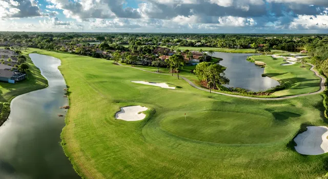a view of a golf course with a swimming pool