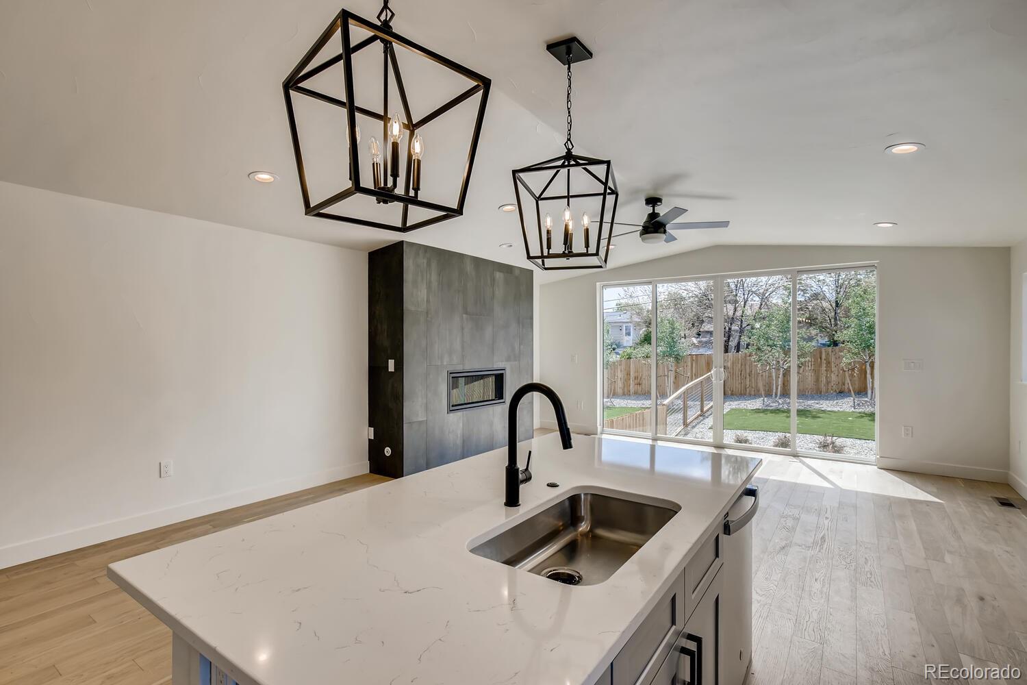 949 Raleigh Street, Unit 2 Denver, CO 80204 - Photo 13 of 26 a kitchen with a sink a counter space and cabinets