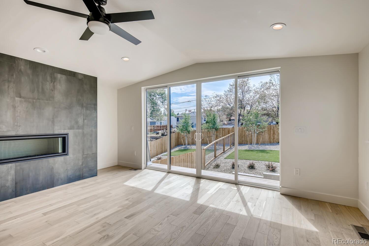 949 Raleigh Street, Unit 2 Denver, CO 80204 - Photo 17 of 26 a view of an empty room with wooden floor and a window