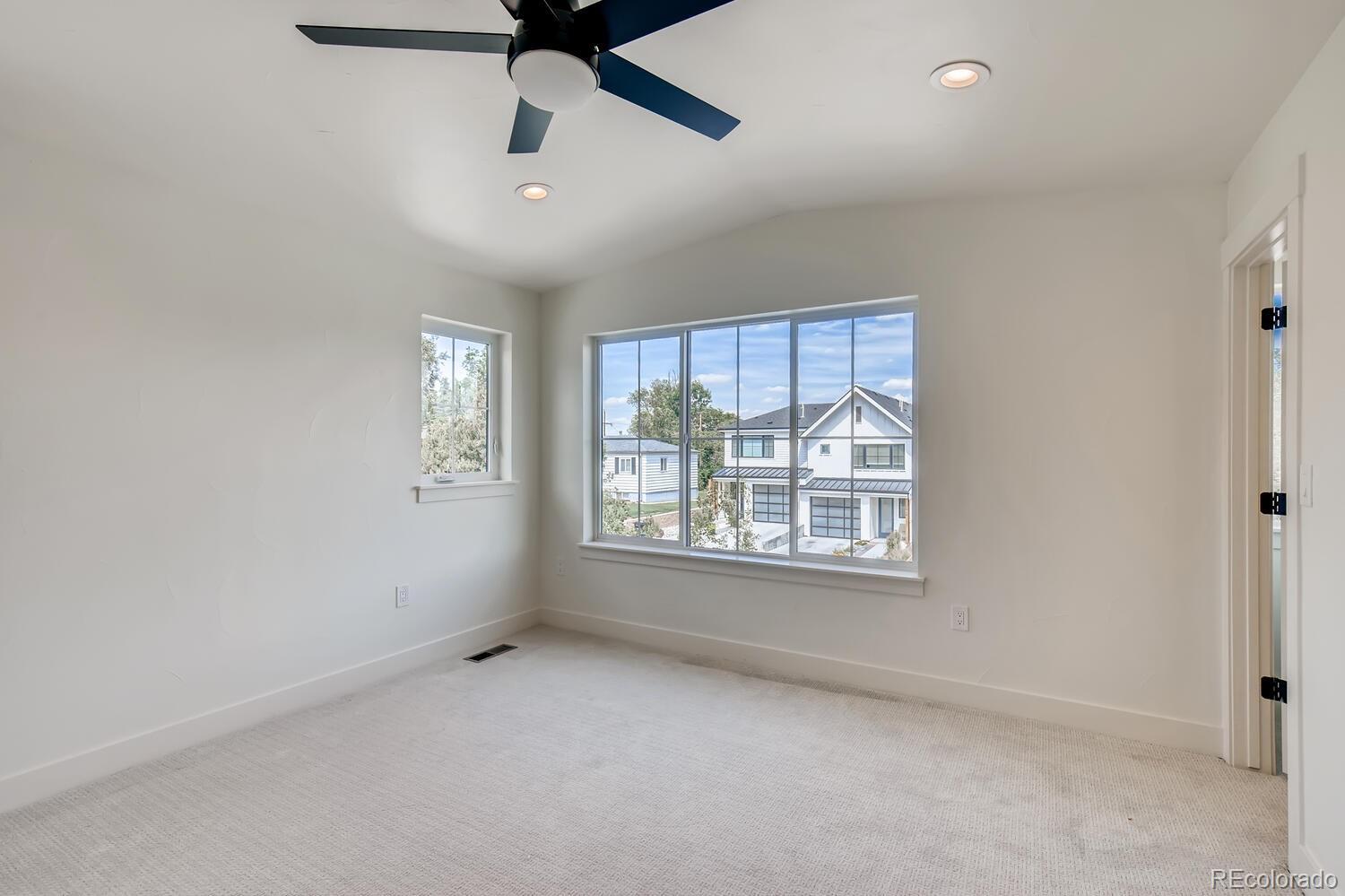 949 Raleigh Street, Unit 2 Denver, CO 80204 - Photo 19 of 26 an empty room with a window and a ceiling fan