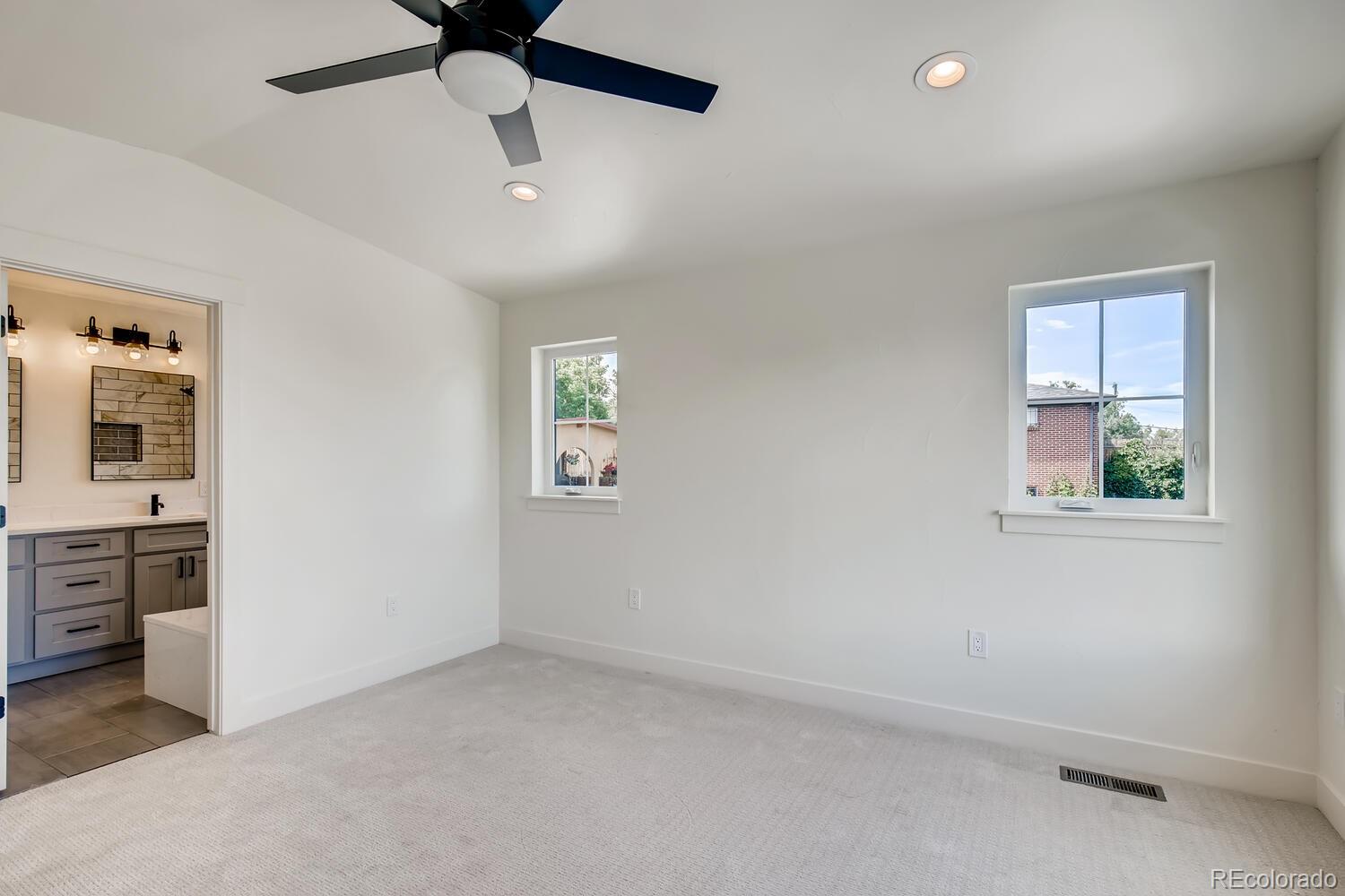 949 Raleigh Street, Unit 2 Denver, CO 80204 - Photo 20 of 26 an empty room with windows and ceiling fan