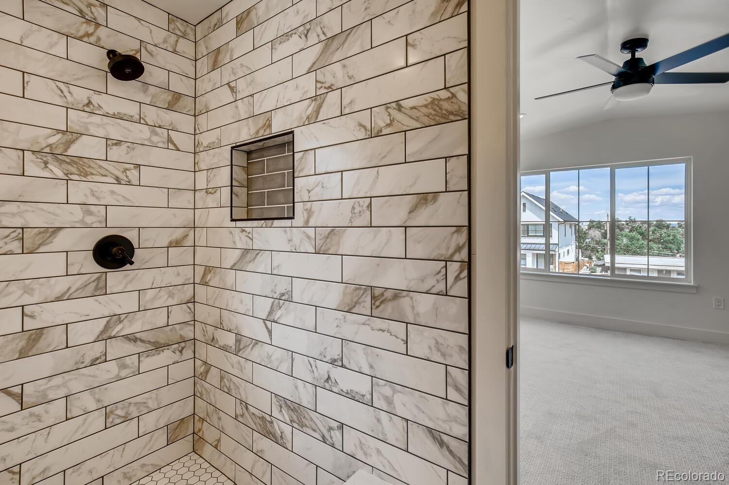 949 Raleigh Street, Unit 2 Denver, CO 80204 - Photo 23 of 26 a bathroom with a shower