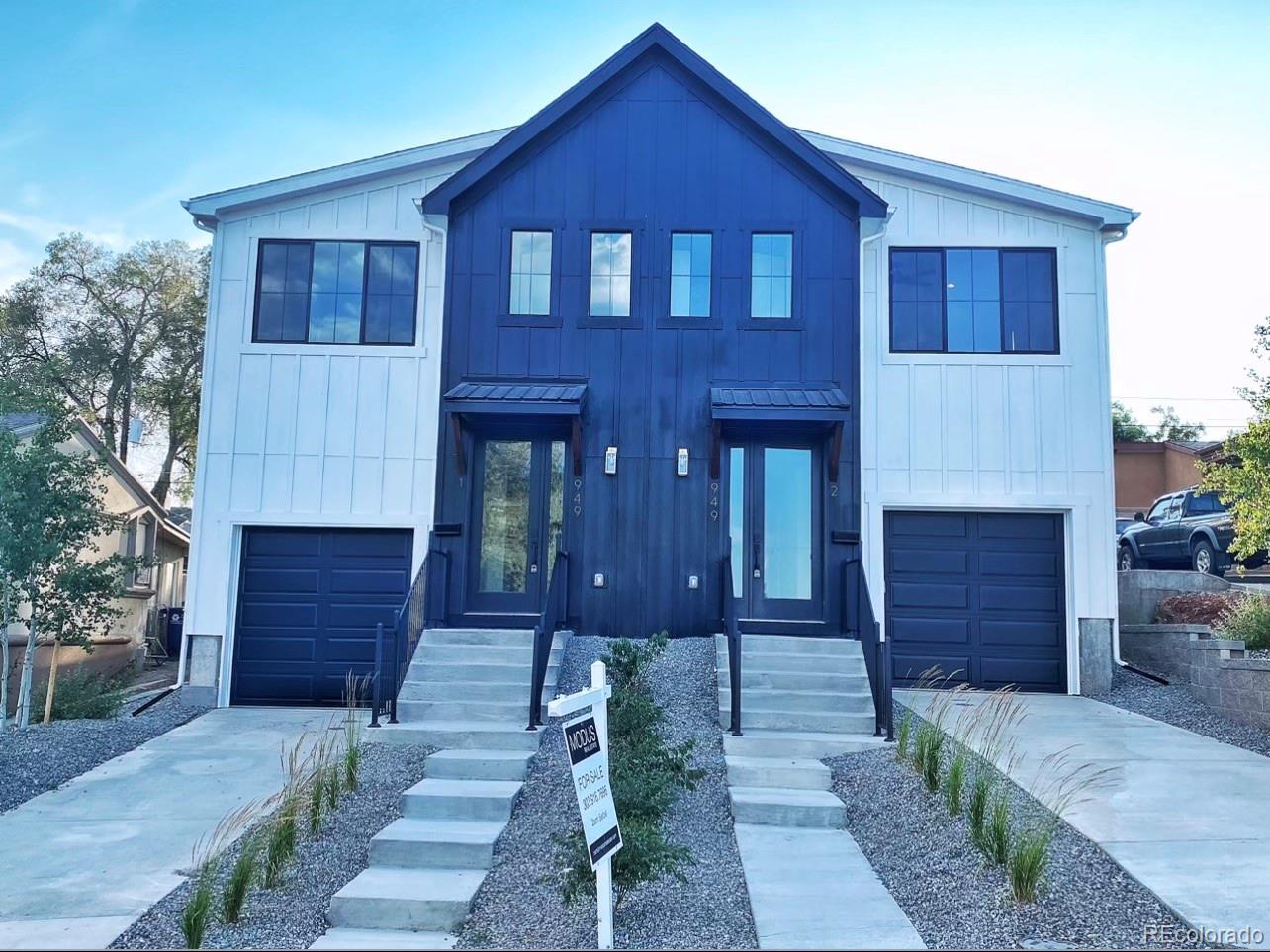 949 Raleigh Street, Unit 2 Denver, CO 80204 - Photo 26 of 26 a front view of a house with a yard