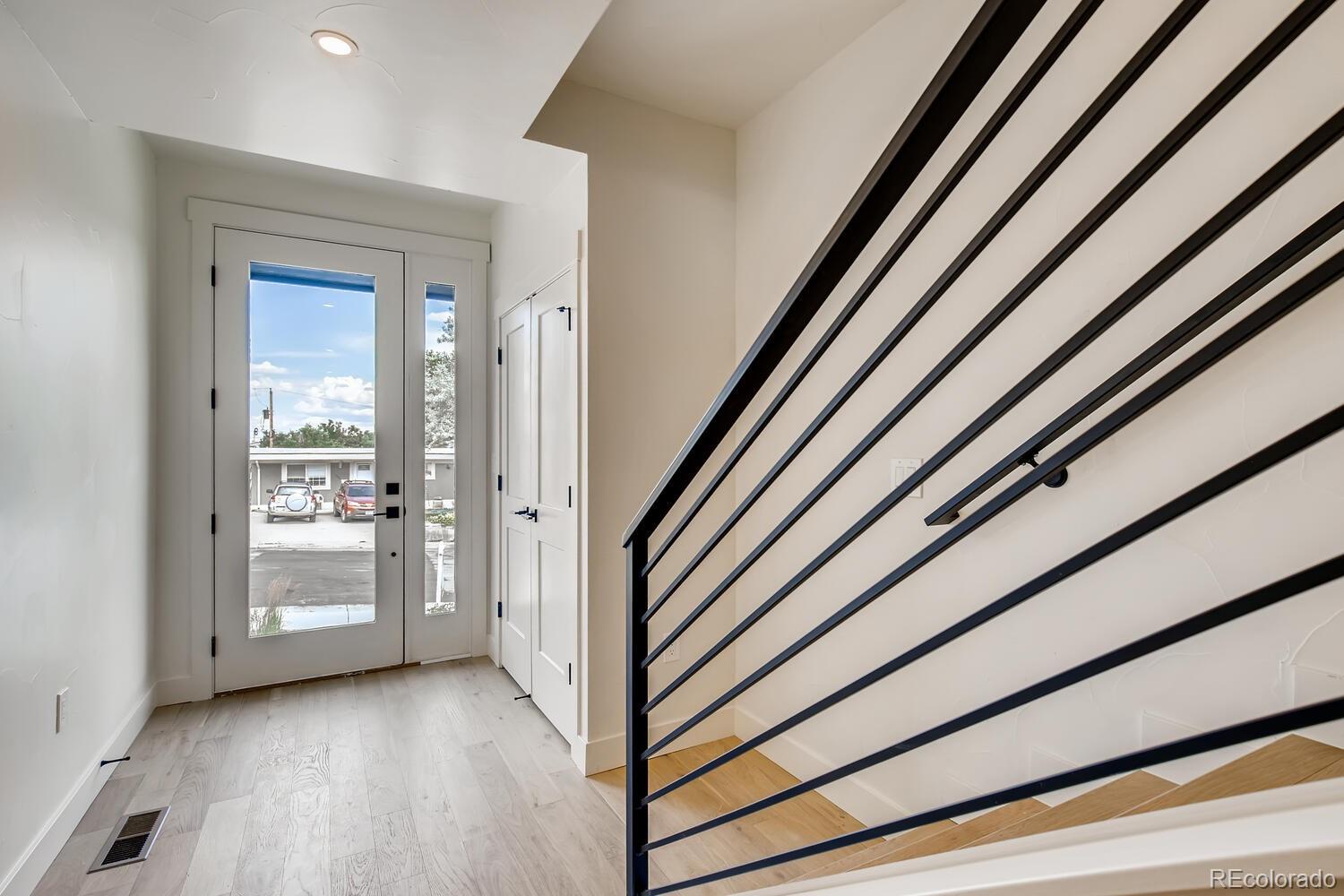 949 Raleigh Street, Unit 2 Denver, CO 80204 - Photo 3 of 26 a view of a hallway with wooden floor and entryway