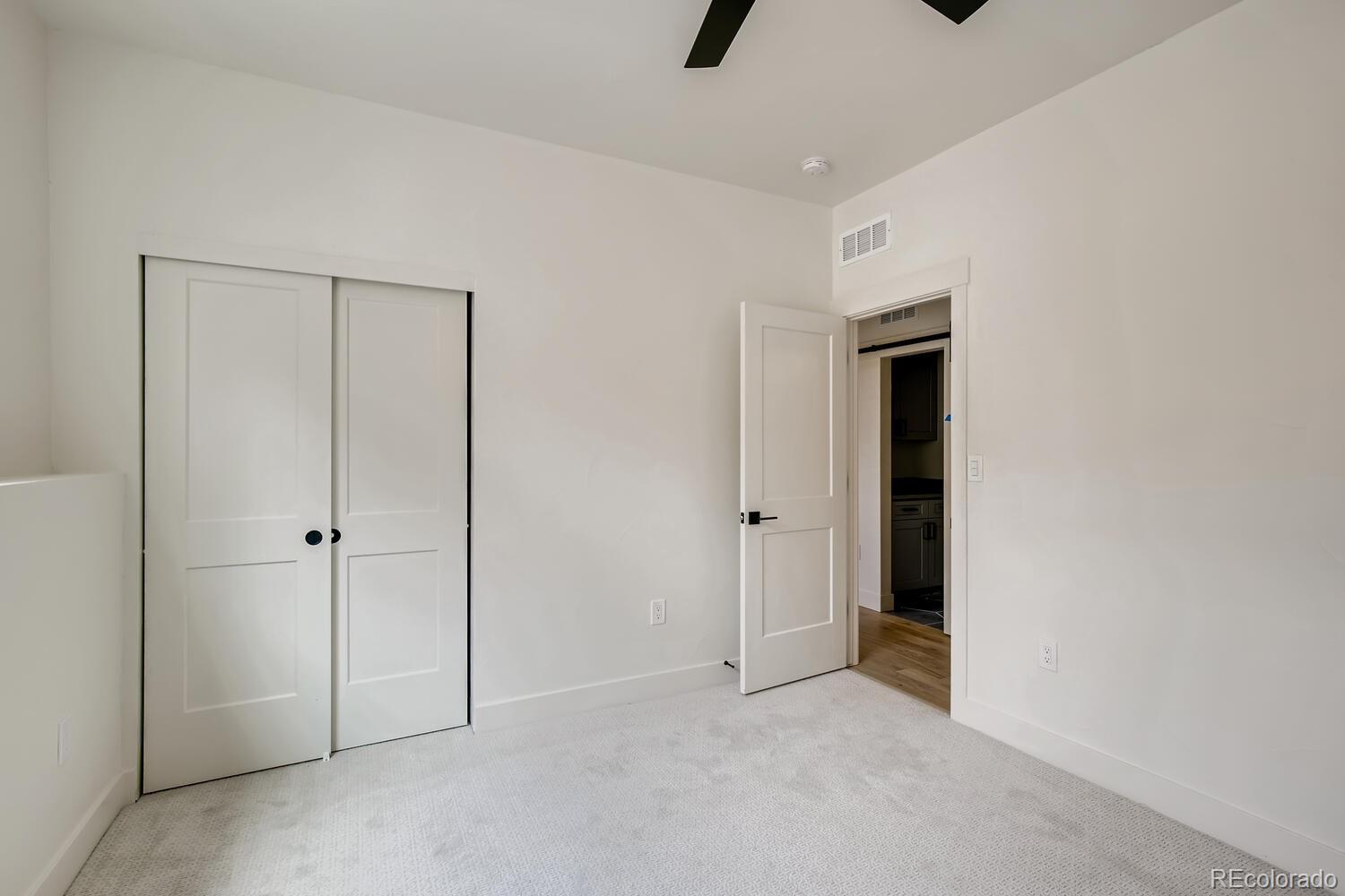 949 Raleigh Street, Unit 2 Denver, CO 80204 - Photo 5 of 26 wooden floor and closet in a room