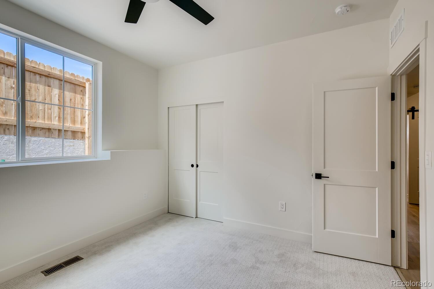 949 Raleigh Street, Unit 2 Denver, CO 80204 - Photo 6 of 26 an empty room with a empty space and windows