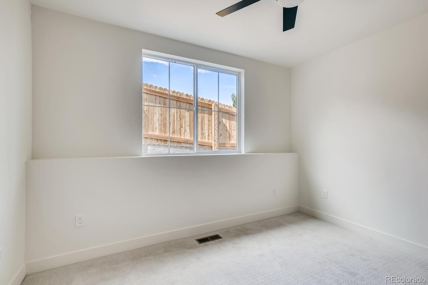 949 Raleigh Street, Unit 2 Denver, CO 80204 - Photo 7 of 26 an empty room with a window