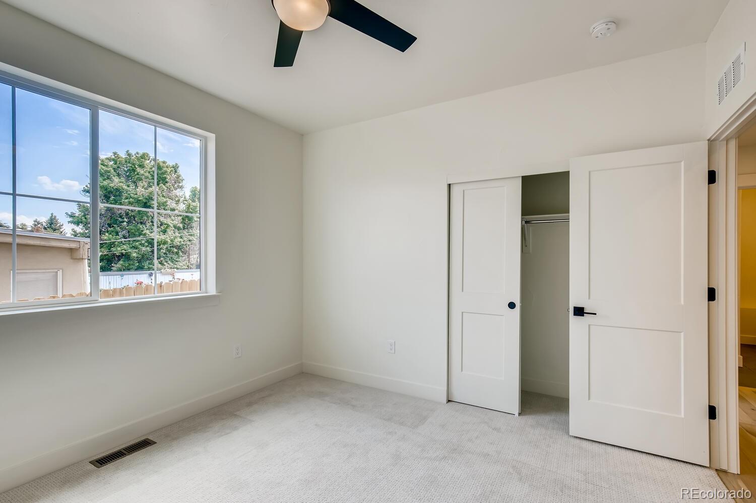 949 Raleigh Street, Unit 2 Denver, CO 80204 - Photo 9 of 26 a view of an empty room with a window