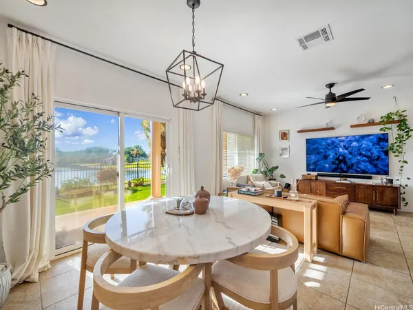 a view of a dining room with furniture window and outside view