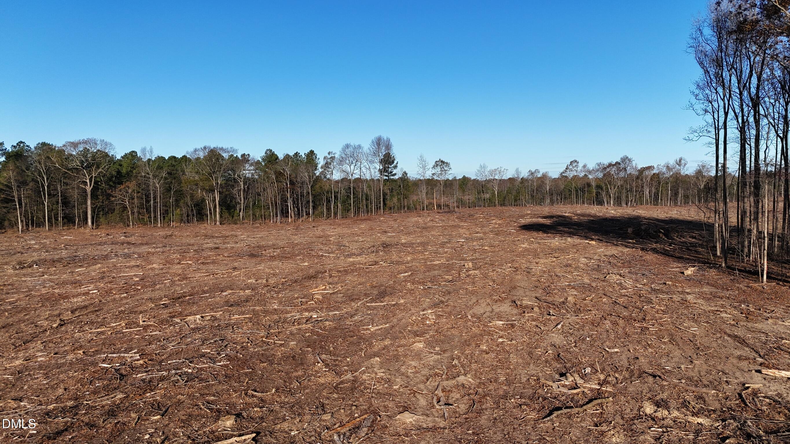 1604 Bonlee School Road Bear Creek, NC 27207 - Photo 28 of 71 a view of a lake with houses in the back