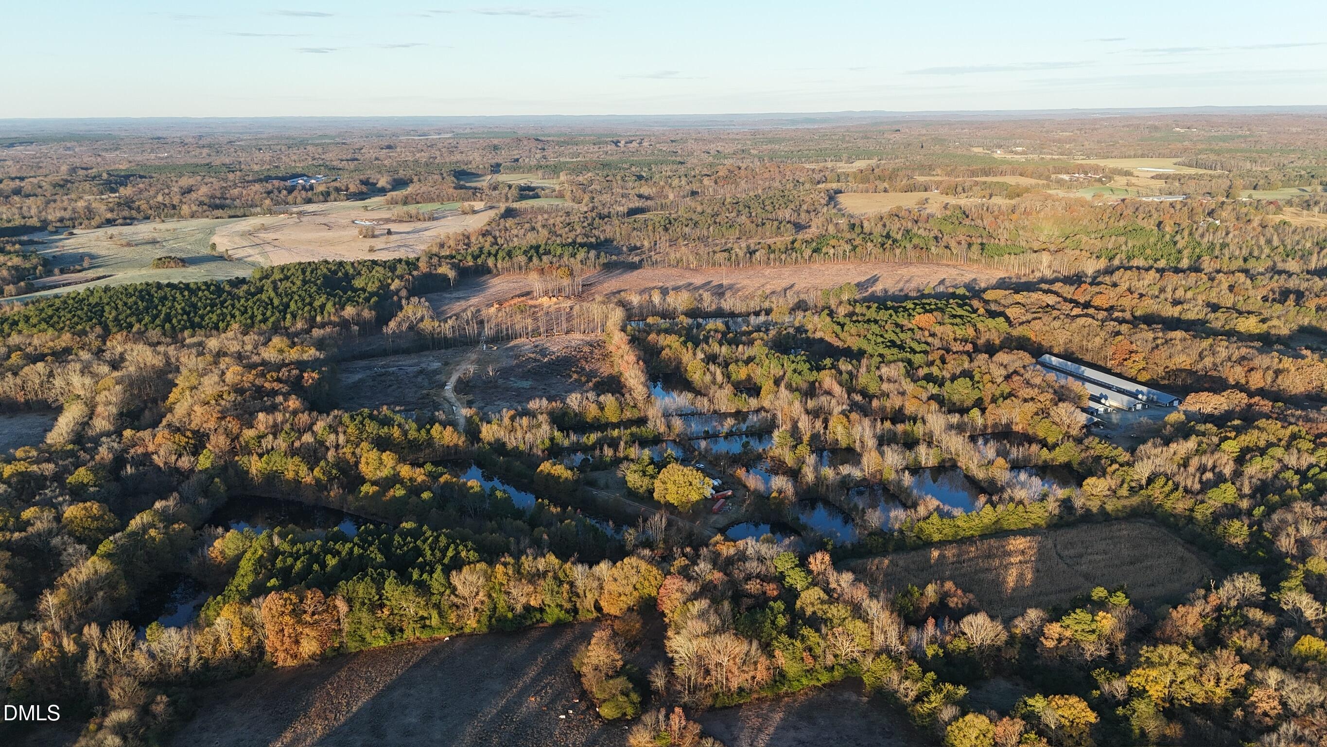 1604 Bonlee School Road Bear Creek, NC 27207 - Photo 8 of 71 an aerial view of residential building and lake