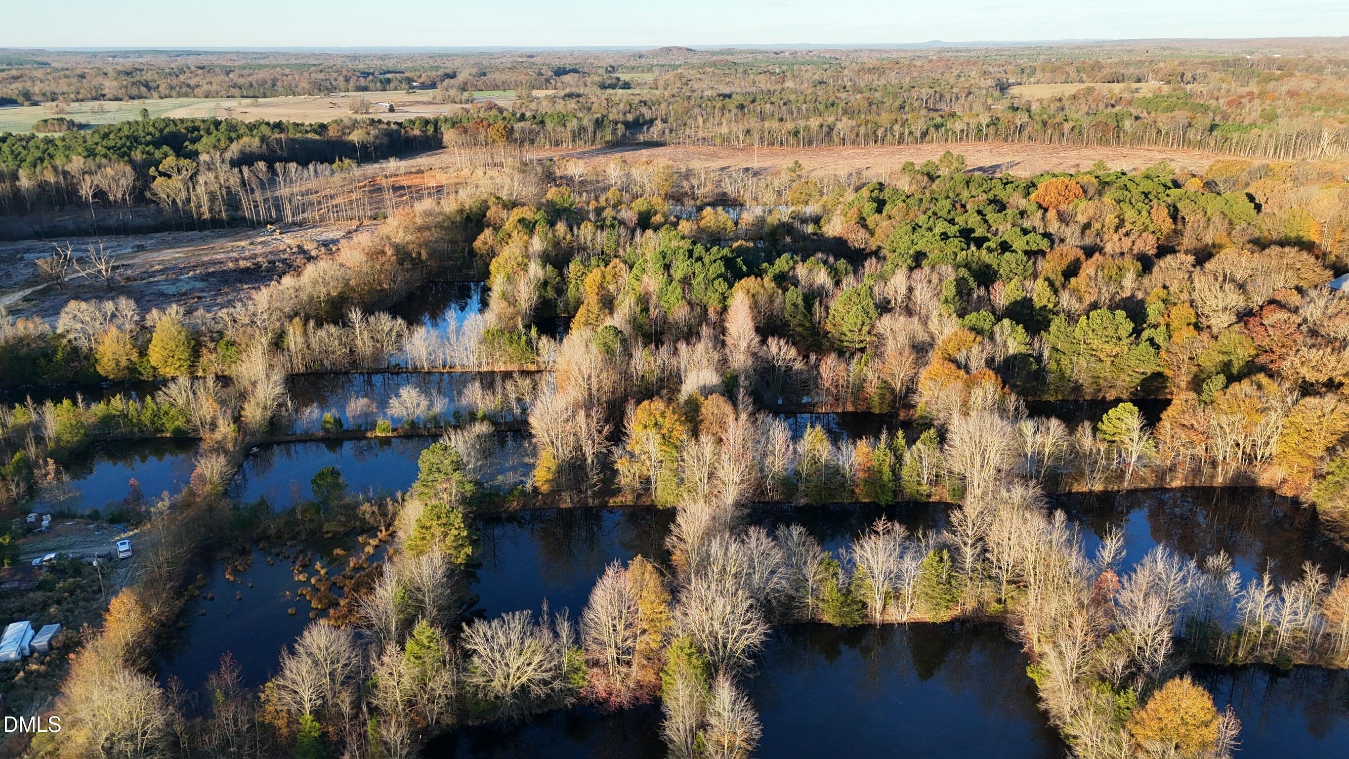 1604 Bonlee School Road Bear Creek, NC 27207 - Photo 9 of 71 an aerial view of residential houses with outdoor space