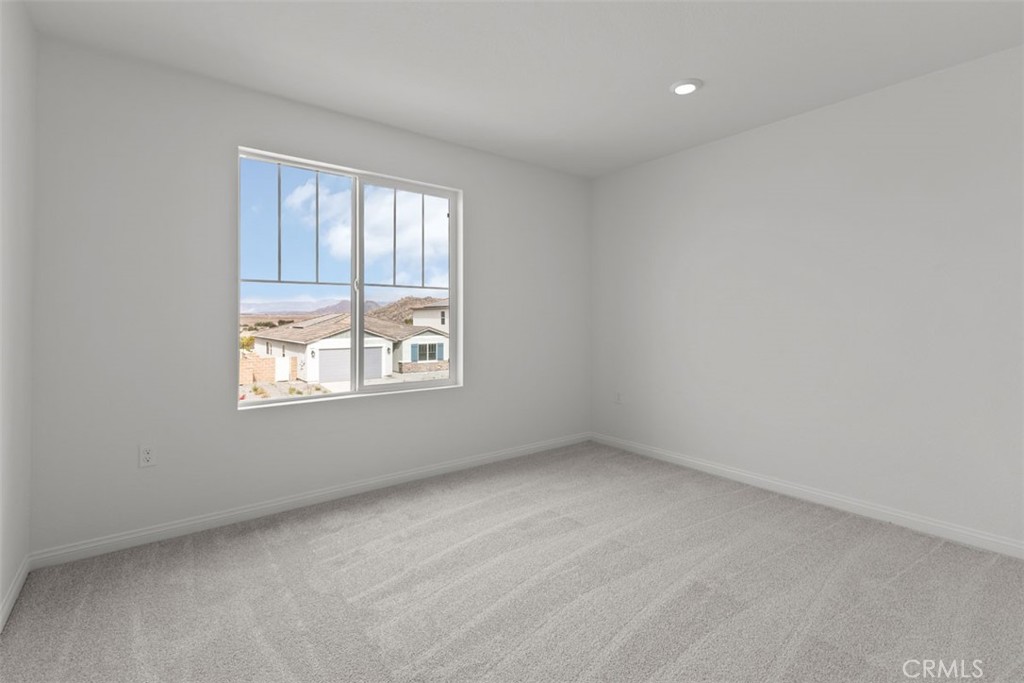 27353 Dunite Drive Perris, CA 92571 - Photo 11 of 18 an empty room with windows
