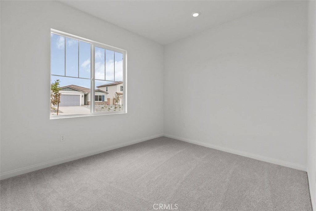 27353 Dunite Drive Perris, CA 92571 - Photo 2 of 18 an empty room with windows