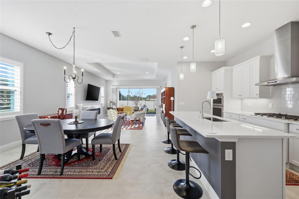 2154 Wallingford Loop Mount Mount Dora, FL 32757 - Photo 12 of 52 a view of a dining room with furniture