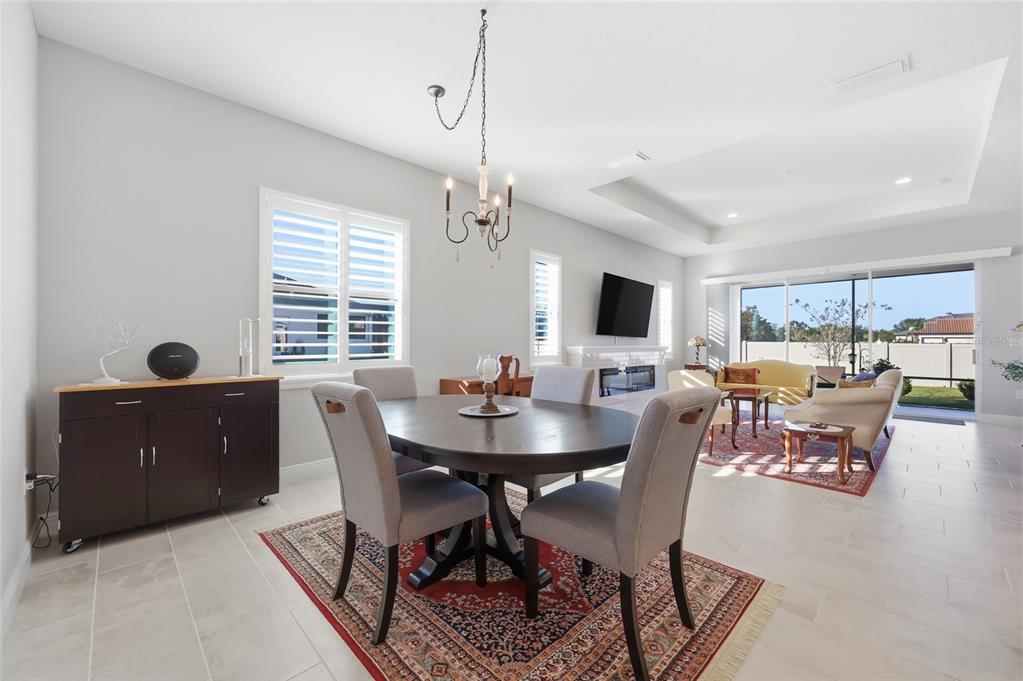 2154 Wallingford Loop Mount Mount Dora, FL 32757 - Photo 13 of 52 a view of a dining room with furniture