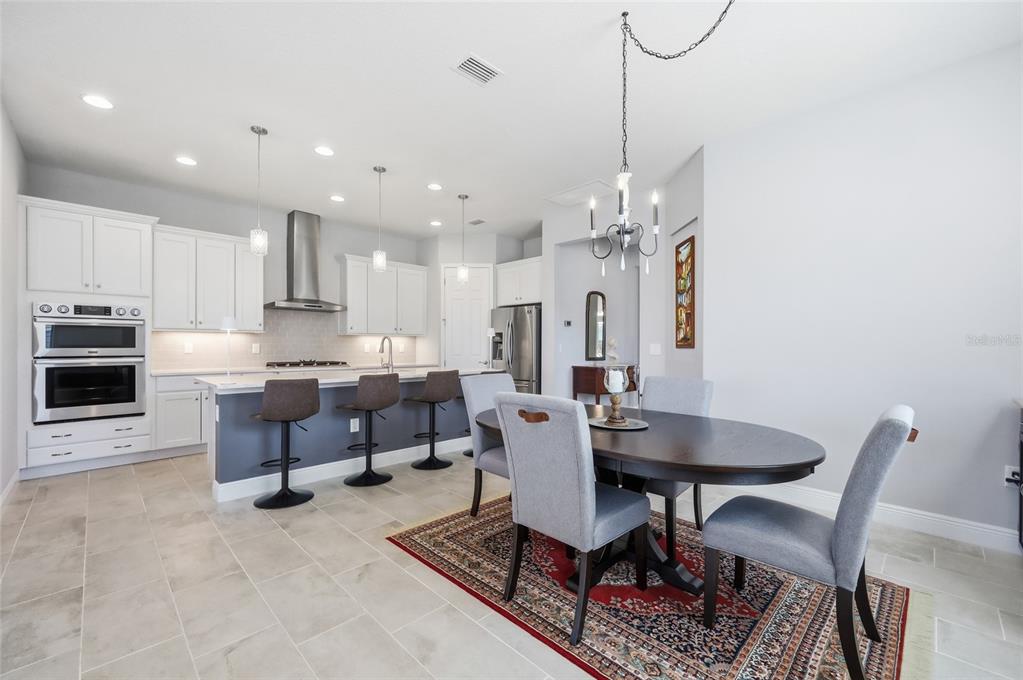 2154 Wallingford Loop Mount Mount Dora, FL 32757 - Photo 14 of 52 a view of a dining room with furniture