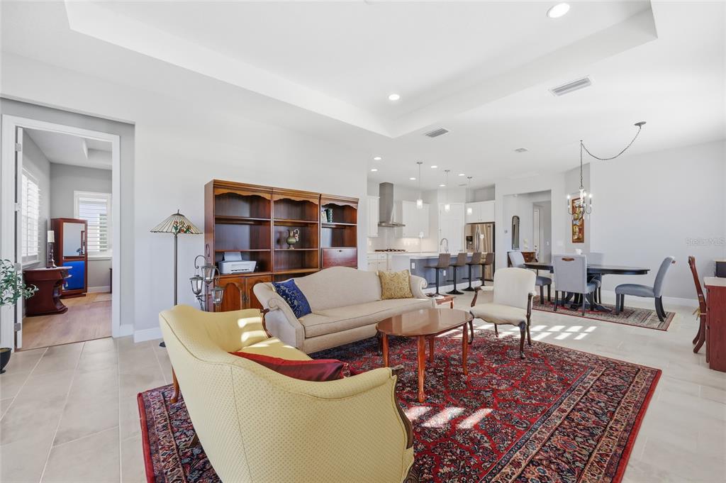2154 Wallingford Loop Mount Mount Dora, FL 32757 - Photo 21 of 52 a living room with furniture and a rug