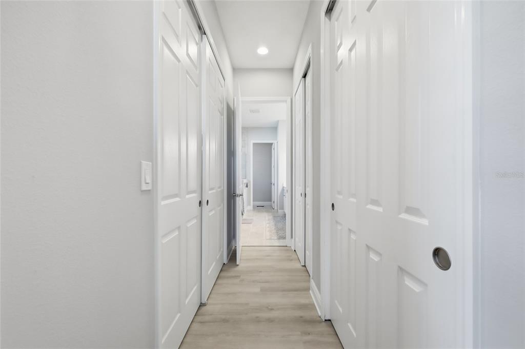2154 Wallingford Loop Mount Mount Dora, FL 32757 - Photo 25 of 52 a view of a hallway with wooden shelves