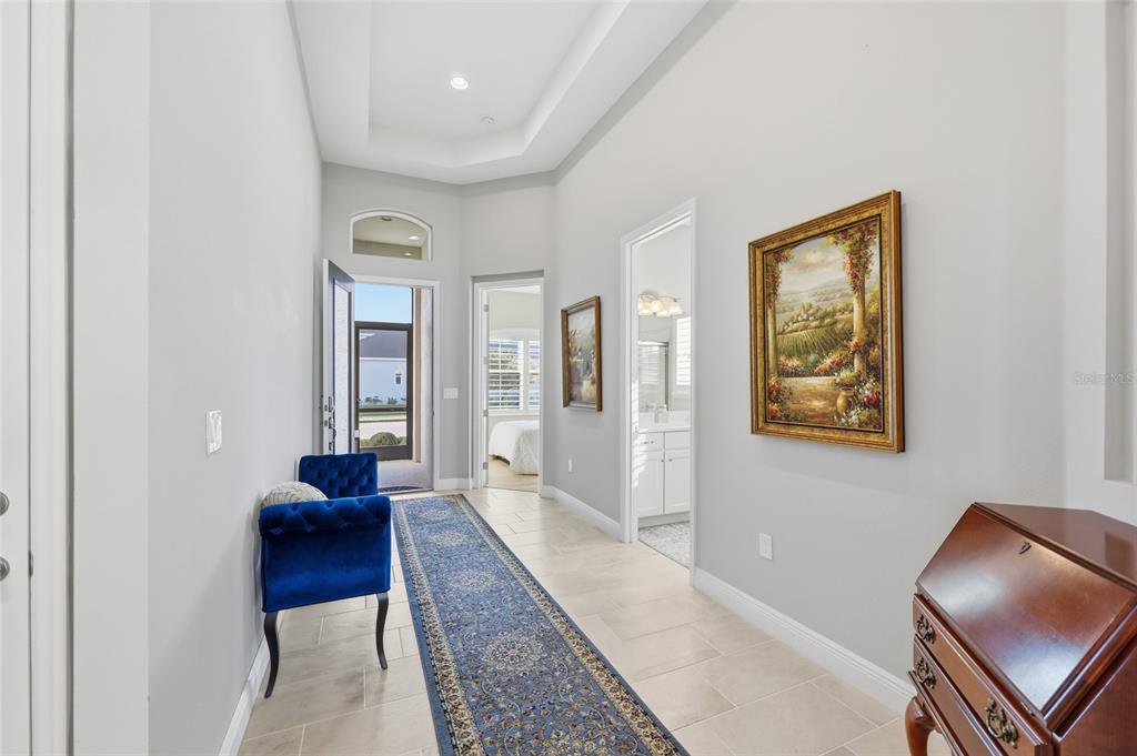 2154 Wallingford Loop Mount Mount Dora, FL 32757 - Photo 26 of 52 a hallway with furniture and a rug