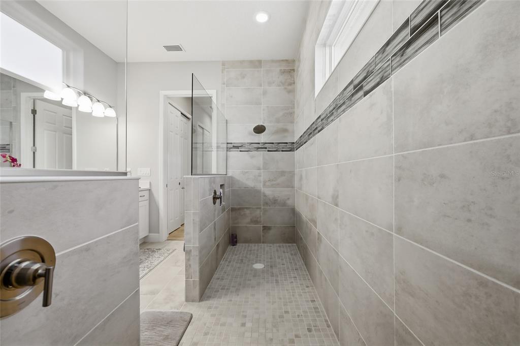 2154 Wallingford Loop Mount Mount Dora, FL 32757 - Photo 32 of 52 a bathroom with a shower