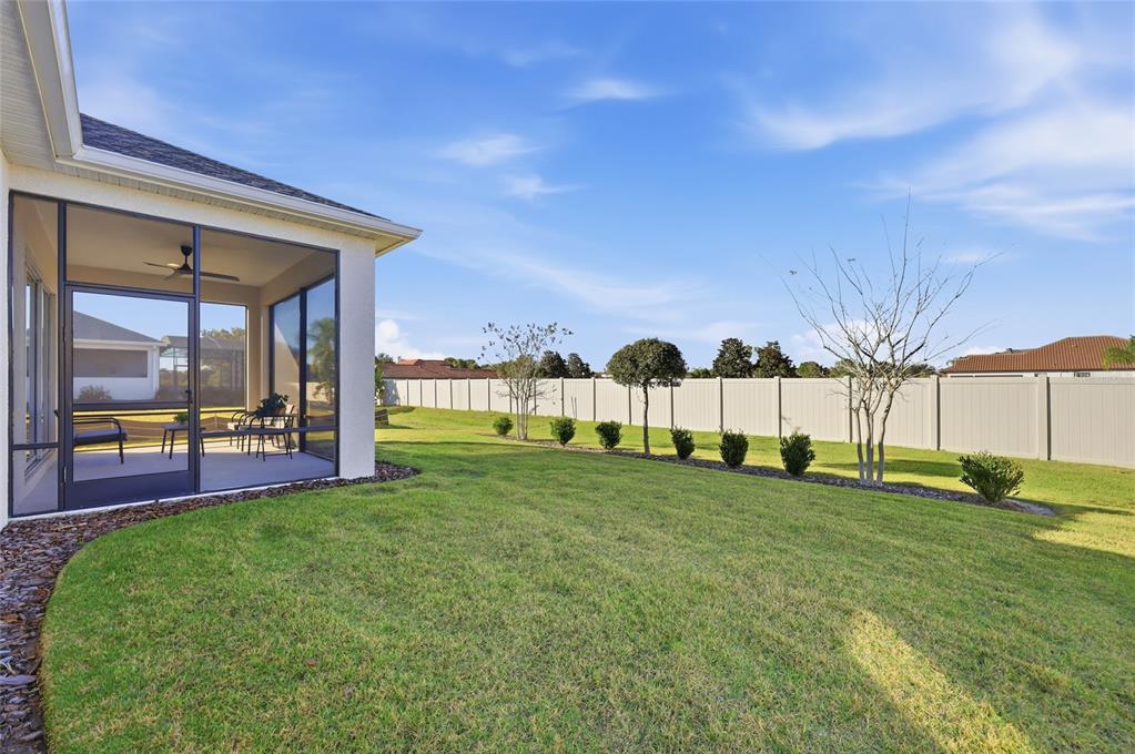 2154 Wallingford Loop Mount Mount Dora, FL 32757 - Photo 35 of 52 a view of a backyard of the house