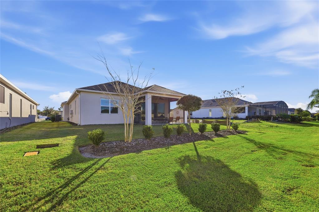 2154 Wallingford Loop Mount Mount Dora, FL 32757 - Photo 36 of 52 a front view of a house with a yard
