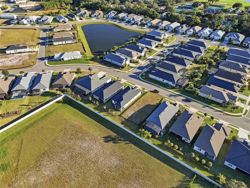 2154 Wallingford Loop Mount Mount Dora, FL 32757 - Photo 44 of 52 an aerial view of residential houses with outdoor space