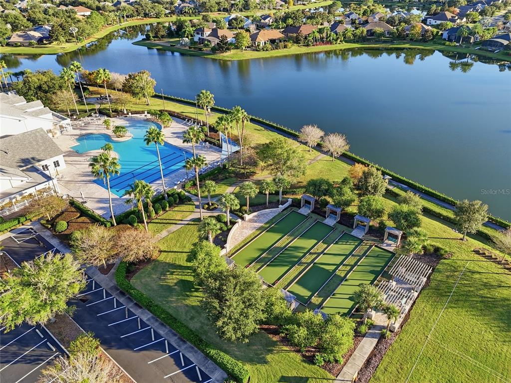 2154 Wallingford Loop Mount Mount Dora, FL 32757 - Photo 49 of 52 a view of a lake with a table and chairs