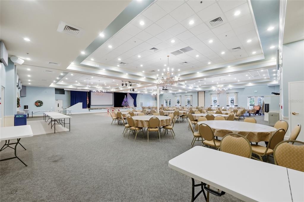 2154 Wallingford Loop Mount Mount Dora, FL 32757 - Photo 51 of 52 a living room with lots of furniture and a chandelier