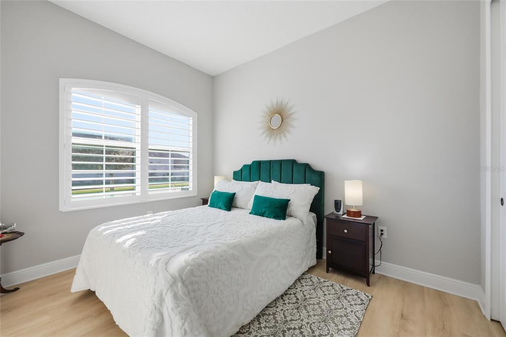 2154 Wallingford Loop Mount Mount Dora, FL 32757 - Photo 7 of 52 a bedroom with bed and a window