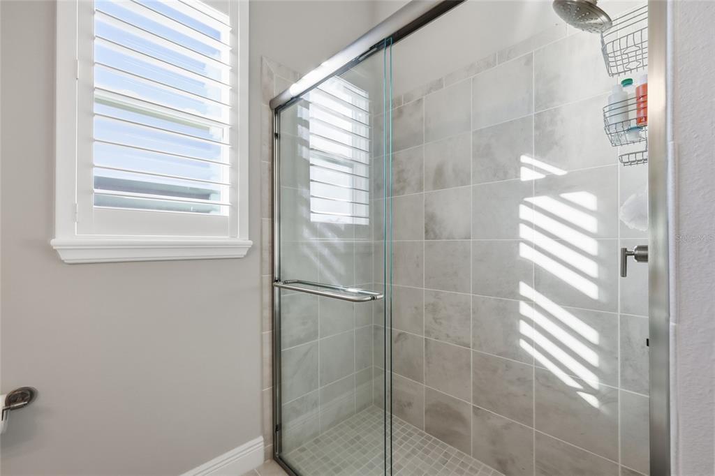 2154 Wallingford Loop Mount Mount Dora, FL 32757 - Photo 9 of 52 a bathroom with a shower
