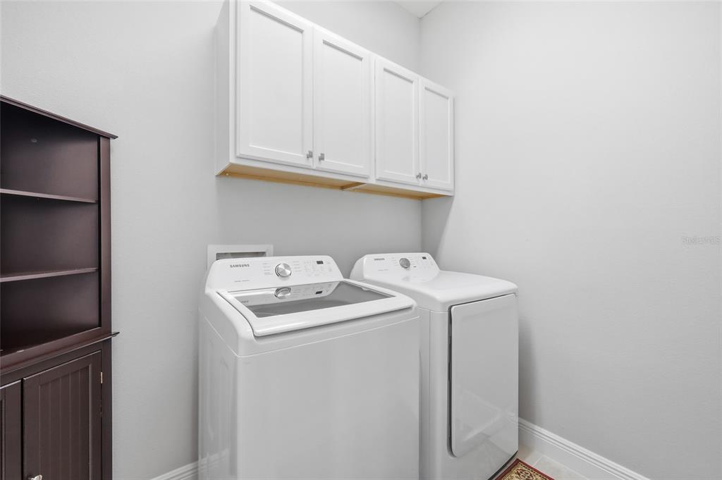 2154 Wallingford Loop Mount Mount Dora, FL 32757 - Photo 10 of 52 a utility room with dryer and washer