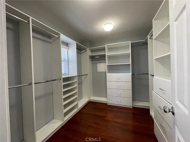 a view of an empty walk in closet