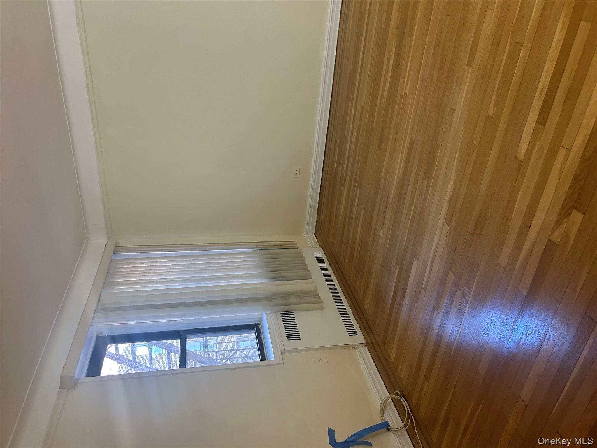 15501 90th Avenue, Unit 3M Queens, NY 11432 - Photo 3 of 6 a view of an empty room and window